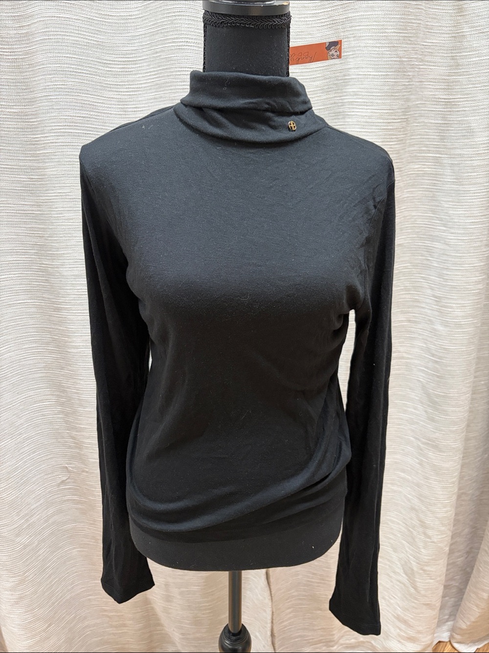 Anine Bing Slim Black Turtleneck Top with Small Gold Emblem